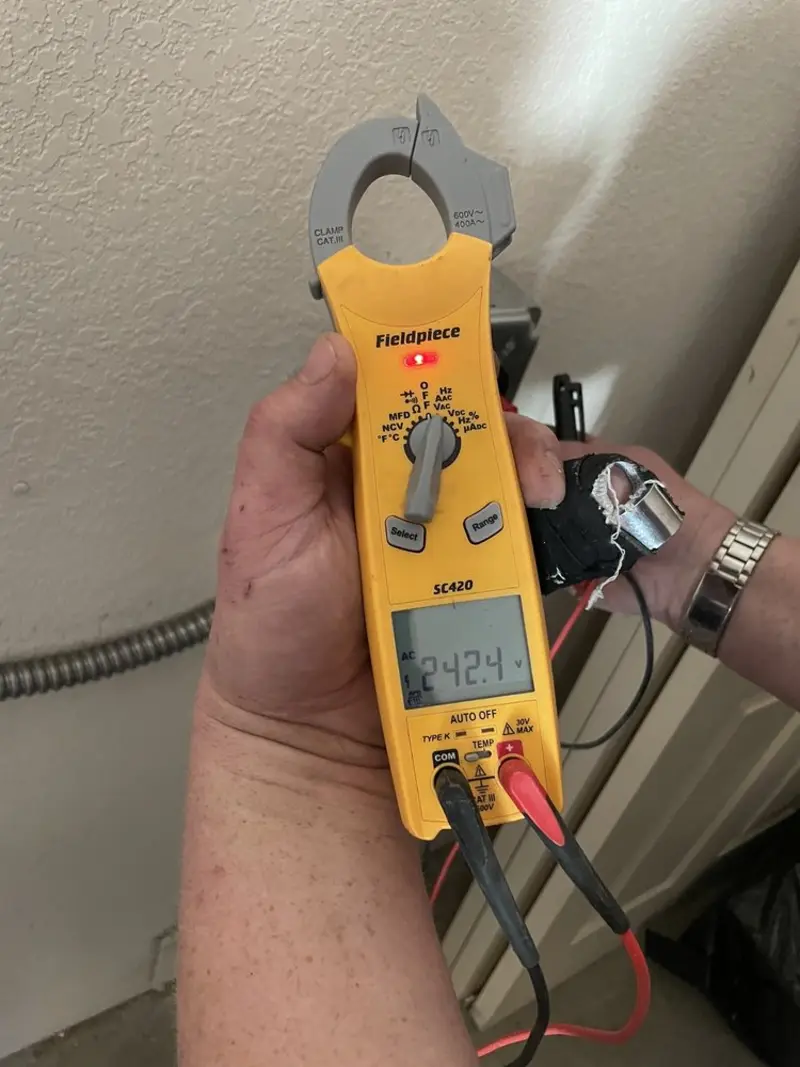 Voltage testing with clamp meter during Circuit Breaker Repair in Gray